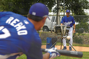 Former Dodger great Maury Wills assists with bunting practice during 2007 spring training